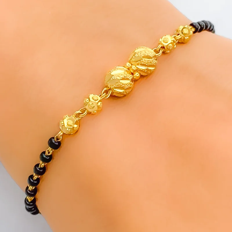 Women’s friendship bracelets-Upscale Twin Orb 22k Gold Black Bead Bracelet